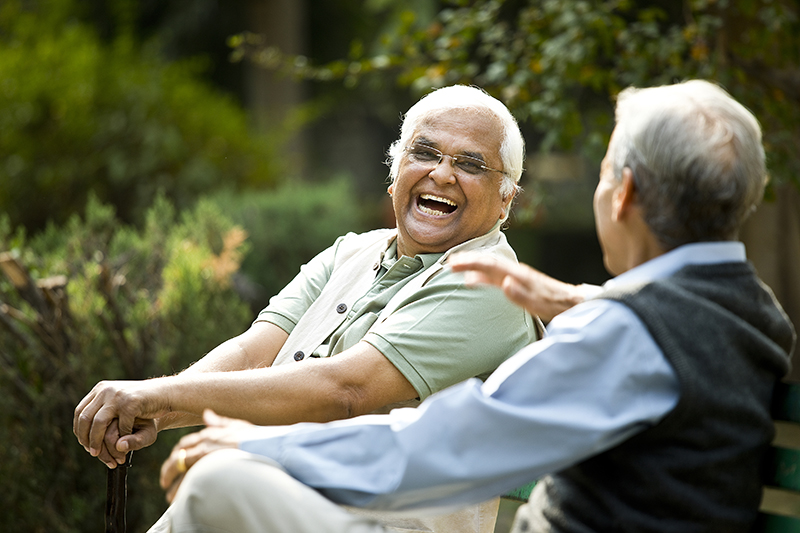 Two senior aged men enjoying time outside